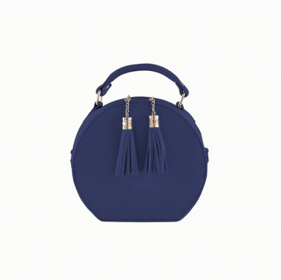 A Pink Round Purse With Tassels On The Side GIF