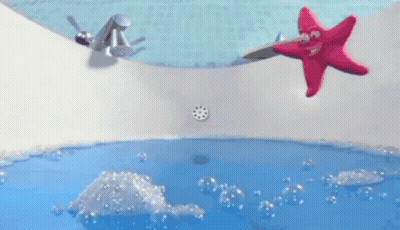 A Pink Starfish Is Floating In A Bathtub With Blue Water GIF