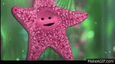 A Pink Starfish With A Face On It Is Swimming In The Water . GIF