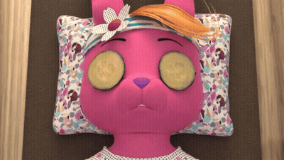 A Pink Stuffed Animal With Cucumber Slices On Her Eyes GIF