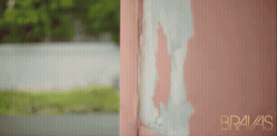 A Pink Wall With Bravas Written On The Bottom GIF