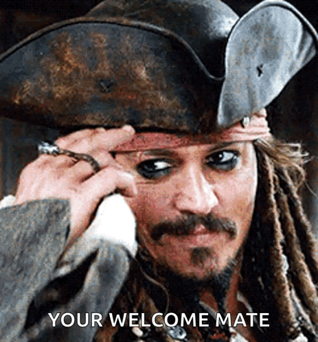 A Pirate With Dreadlocks And A Ring On His Finger Says Your Welcome Mate GIF
