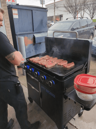 A Pit Boss Grill Is Being Used By A Man GIF