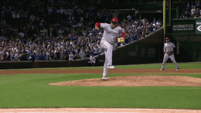 A Pitcher Wearing A Jersey That Says Cincinnati Reds Throws A Pitch GIF