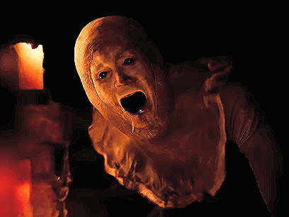 A Pixel Art Of A Monster With A Candle Behind It GIF