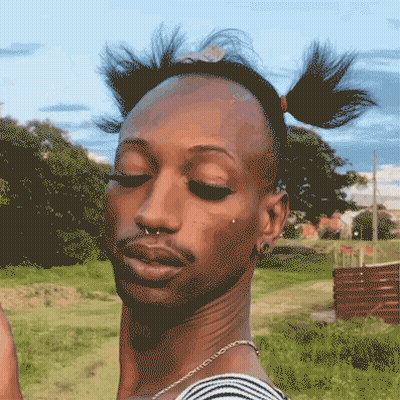 A Pixelated Drawing Of A Man With Pigtails And A Nose Ring GIF