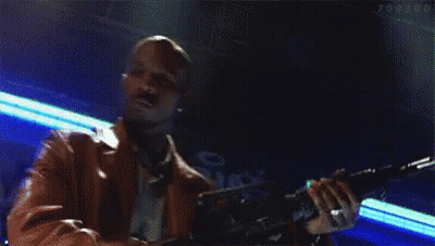 A Pixelated Image Of A Man Holding A Gun With The Word Tomorrow In The Background GIF
