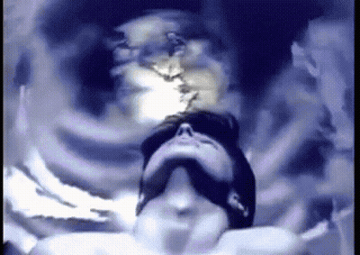 A Pixelated Image Of A Man Looking Up At Something GIF