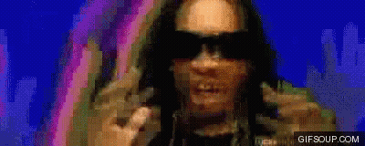 A Pixelated Image Of A Man Wearing Sunglasses With The Website Gifsoup.com In The Lower Right Corner GIF