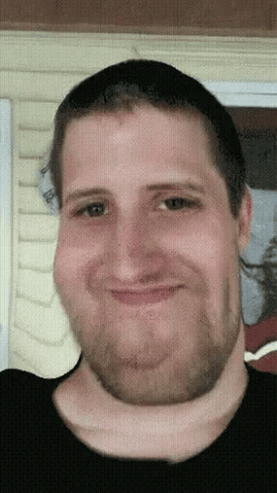 A Pixelated Image Of A Man With A Beard GIF