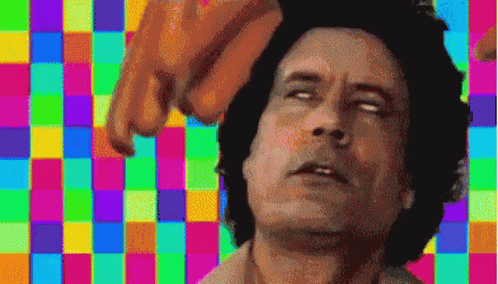 A Pixelated Image Of A Man With A Colorful Checkered Background GIF