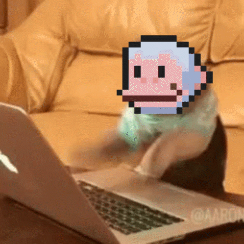 A Pixelated Image Of A Monkey Is On A Laptop GIF