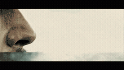 A Pixelated Image Of A Person 'S Nose Smelling Something GIF