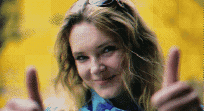 A Pixelated Image Of A Woman Giving A Thumbs Up Sign GIF