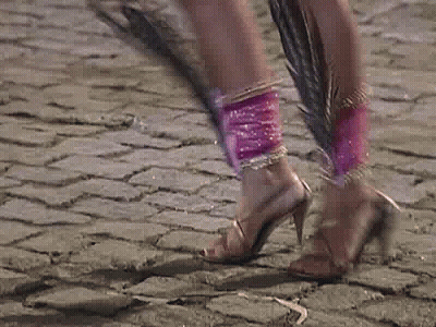 A Pixelated Image Of A Woman In A Pink Dress GIF