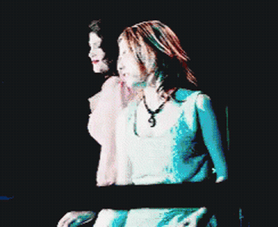 A Pixelated Image Of Two Women Dancing With One Wearing A Pink Top GIF