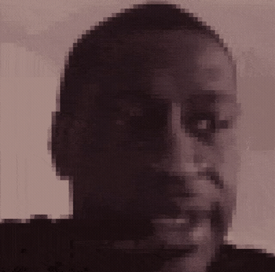 A Pixelated Picture Of A Man 'S Face With A Beard GIF