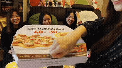 A Pizza Box That Says 40 % 30 % Is Being Opened By A Woman GIF