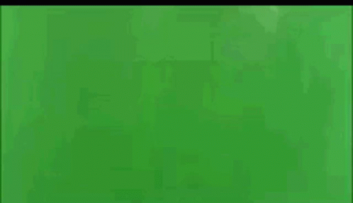 A Plane Is Exploding On A Green Screen With Smoke Coming Out Of It GIF
