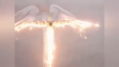 A Plane Is Flying Through The Air With A Flame Coming Out Of It . GIF