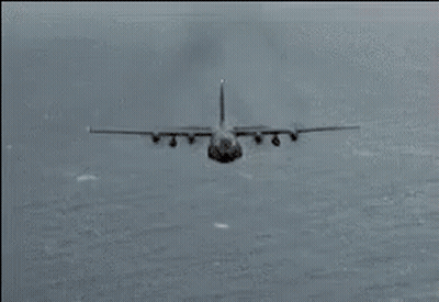 A Plane Is Flying Through The Air With Fire Coming Out Of The Wings GIF