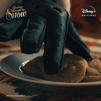 A Plate Of Cookies With The Words Dashing Through The Snow On The Top GIF