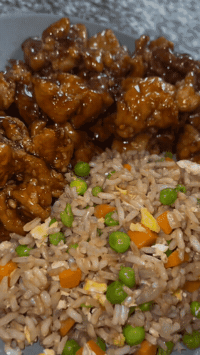 A Plate Of Food With Rice And Peas On It GIF