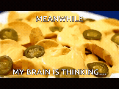 A Plate Of Nachos With Cheese And Jalapenos With A Caption That Says Meanwhile My Brain Is Thinking GIF