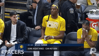 A Player Named Myles Turner Sits In The Stands GIF