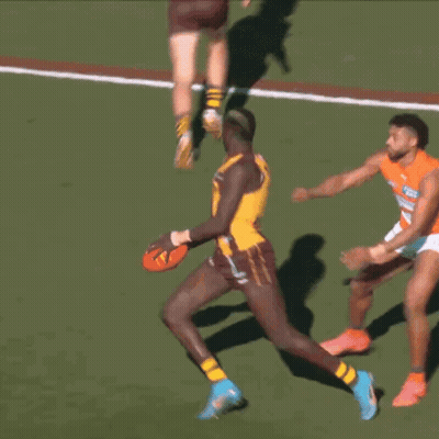 A Player With The Number 11 On His Jersey Is Running With The Ball GIF