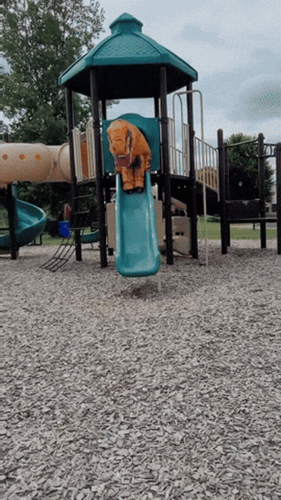 A Playground With A Blue Slide And A Tower GIF