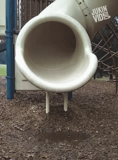 A Playground With A Slide And A Sign That Says Jukin Video GIF