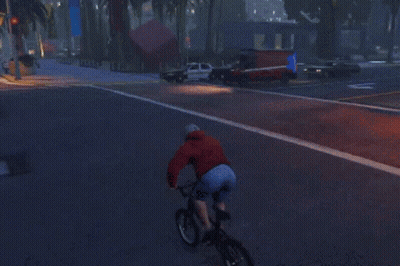 A Police Car Is Driving Down A Street With A White Arrow Pointing To The Left GIF