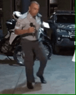 A Police Officer Breakdancing GIF