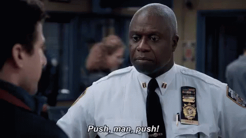 A Police Officer In A White Uniform And Tie Is Talking To Another Police Officer . GIF