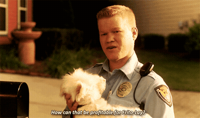 A Police Officer Is Holding A Small White Dog And Says How Can That Be Profitable For Frito-Lay GIF