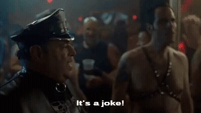 A Police Officer Is Standing Next To A Shirtless Man In A Club And Says `` It 'S A Joke '' . GIF