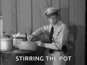 A Police Officer Is Stirring A Pot Of Food In A Black And White Photo . GIF