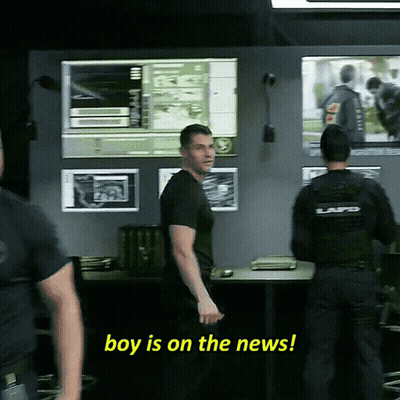 A Police Officer Says Boy Is On The News While Standing Next To Another Officer GIF