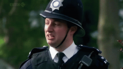 A Police Officer Says Go To Prison In Front Of Trees GIF