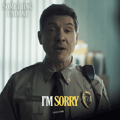 A Police Officer Says I 'M Sorry In Yellow GIF