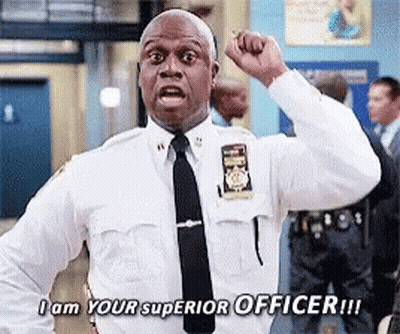 A Police Officer With His Fist In The Air Says I Am Your Superior Officer GIF