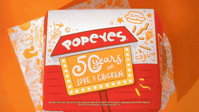 A Popeye 'S Box That Says 50 Years Love Chicken GIF