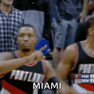 A Portland Basketball Player Is Pointing At The Crowd And The Word Miami Is Visible GIF