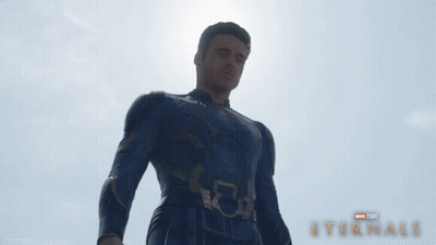 A Poster For A Movie Called Eternals With A Man In A Suit GIF