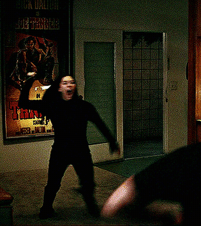 A Poster For A Movie Called Tanner Hangs On A Wall Next To A Door GIF