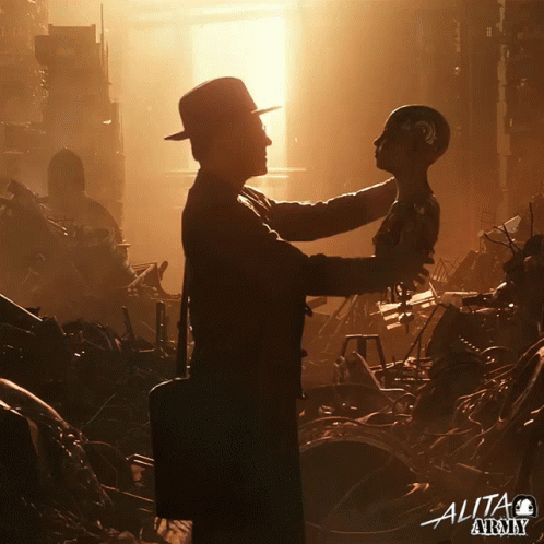 A Poster For Alita Army Shows A Man Holding A Robot In His Arms GIF