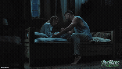 A Poster For Avengers Age Of Ultron Shows A Man And A Girl On A Bed GIF