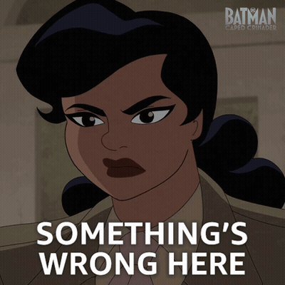 A Poster For Batman Caped Crusader Shows A Woman And The Words Something 'S Wrong Here GIF