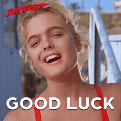 A Poster For Baywatch Shows A Woman Smiling And The Words Good Luck Below Her GIF